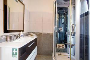 a bathroom with a sink and a shower at Casa da Bemposta in Machico +19 photos