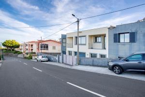a car parked on the side of a street at Casa da Bemposta in Machico