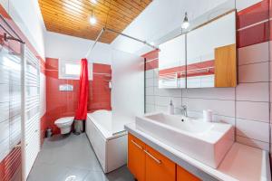a bathroom with a sink and a toilet at Eli Guesthouse in Kavos +107 photos