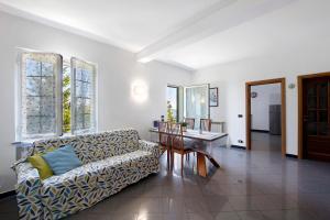 a living room with a couch and a table at Ai campi in Stella