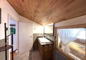 a bathroom with a sink and a mirror at Maso 1445,Quiet, Breathtaking Views in Siror +37 photos