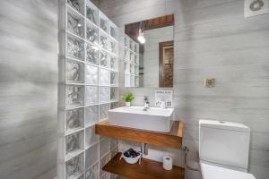 a bathroom with a sink and a mirror at Casa Perico in Borrastre +81 photos