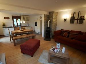 a living room with a couch and a table at Ferienhaus Paula in Forbach