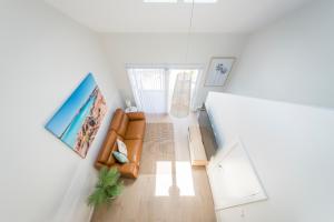 an overhead view of a living room with a couch at Marina 14 Harrington in Manning Point +6 photos