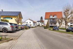 a street with cars parked on the side of the road at Ferienwohnung Reichenau in Reichenau