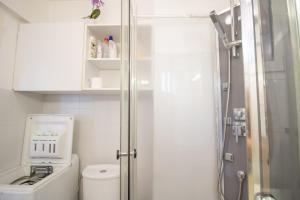 a small bathroom with a shower and a toilet at Résidence Aria Marina Plage in Ajaccio +13 photos