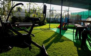 a park with a playground with a swing at VGK Residency in Wayanad