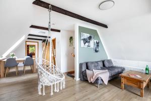 a living room with a couch and a table at Ferienwohnung Carolin Witt in Großsolt