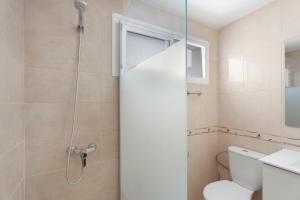 a bathroom with a shower and a toilet at Nido Andrea in San Isidro +16 photos