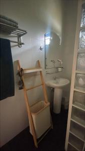 a bathroom with a ladder next to a sink at Thailand Dream Village E09 in Klaeng +13 photos