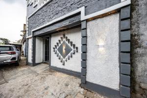 a building with two garage doors with a star on it at Simple Hotel Bogor RedPartner in Bogor