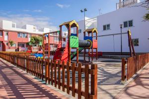 a park with a playground with slides and swings at Villa Florymar in Ingenio