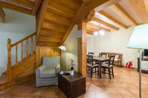 a living room with a table and a dining room at Casa Lindelagua in Pámanes