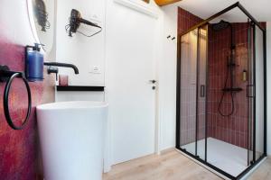 a bathroom with a shower and a sink at La Scaletta in Biella +20 photos