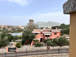 a view of a house with a fence at Orizzonti 32 in Golfo Aranci