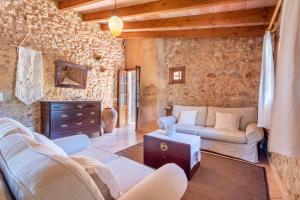 a living room with a couch and a table at Son Xigala in Manacor