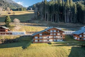 an aerial view of a house in a field at Appartement T3 Chatel in Châtel