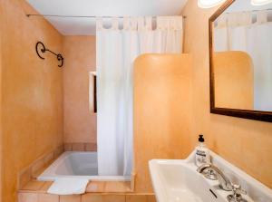 a bathroom with a tub and a sink and a mirror at Son Reus in Felanitx +21 photos