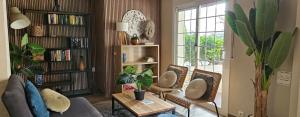 a living room with a couch and chairs and a table at Ainara Luxury in Lloret de Mar