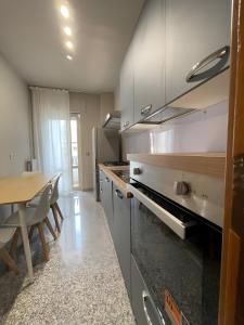 a kitchen with a table and a counter top at Dimora Vibo Centro in Vibo Valentia