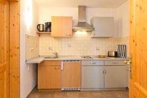 a small kitchen with a sink and a stove at Ferienwohnung Maribell Jabel in Jabel