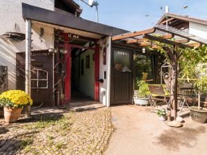 a house with a red door and a patio at Haus Umbeer in Schömberg