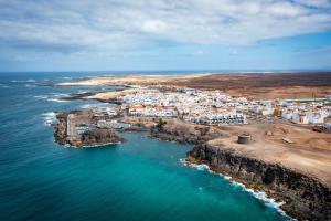 an aerial view of a small island in the ocean at apto luminoso lagos del cotillo in La Oliva