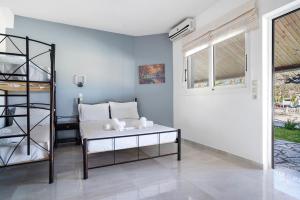 a living room with a table and a window at Iguana studio 11 in Preveza +19 photos