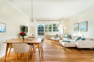 a living room with a table and a couch at Ferienwohnung Waldglück in Hinterzarten