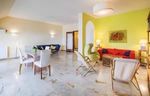 a living room with a couch and a table and chairs at La dimora di Alda in Lavagna
