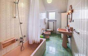a bathroom with two toilets and a tub and a sink at La dimora di Alda in Lavagna +34 photos
