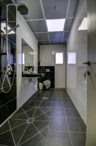 a bathroom with a shower and a toilet and a sink at Moon Cnter in Majdal Shams