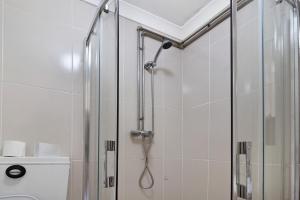a shower with a glass door in a bathroom at Casas do Natureza de Coura in Paredes de Coura
