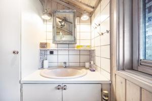 a bathroom with a sink and a mirror at Möwe in Twielenfleth +22 photos