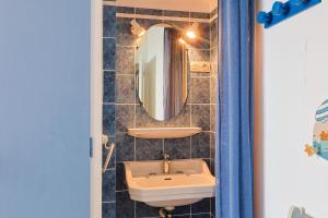 a bathroom with a sink and a mirror at Ti Bihan - Perros Guirec in Perros-Guirec +35 photos