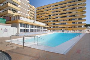 a large swimming pool in front of a building at El Nido de los Ángeles in Playa del Ingles