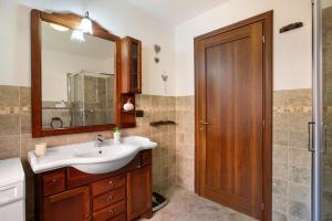 a bathroom with a sink and a mirror at Casa Michod Chatillon - Nonna Genia in Châtillon +23 photos