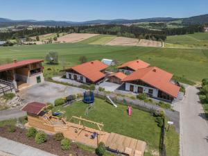 an aerial view of a house with a playground at Ferienwohnung Stod´l in Freyung