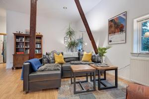 a living room with a couch and a table at Ferienwohnung Varga Schafstedt in Schafstedt