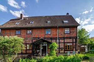 a large red brick house with a brown roof at Villa Gottstreu in Gottstreu
