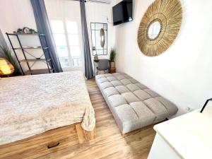 a bedroom with a bed and a large mirror at aeolian blu 5 in Parikia