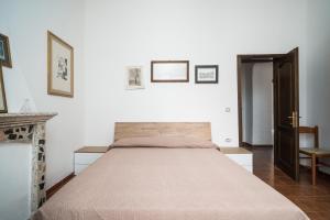 a bedroom with a large bed in a room at Casa Picchereddu in Orosei