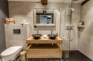 a bathroom with two sinks and a shower at Château De La Rive in Cruet
