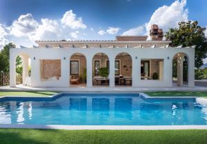 a villa with a swimming pool in front of a house at Umbriance Villa con piscina privata in Stroncone