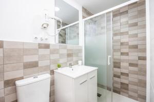 a bathroom with a toilet and a sink and a shower at Gran Sol Family 2 in Felanitx +26 photos
