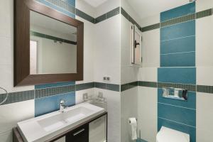 a bathroom with a sink and a mirror at Casa Santana in Vecindario +17 photos