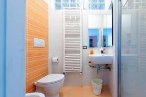 a bathroom with a toilet and a sink at Dimora lungomare terra d'otranto in Otranto +14 photos