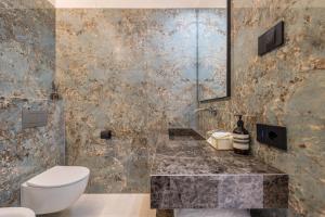 a bathroom with a toilet and a sink at App 302 Palazzo Cavour in Bolzano