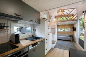 a kitchen in a tiny house with a sink at Tiny House Nr 5 in Schwielowsee