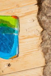 a colorful toy sitting on top of a wooden table at Chalet Atmosfera Res Albert in San Guglielmo